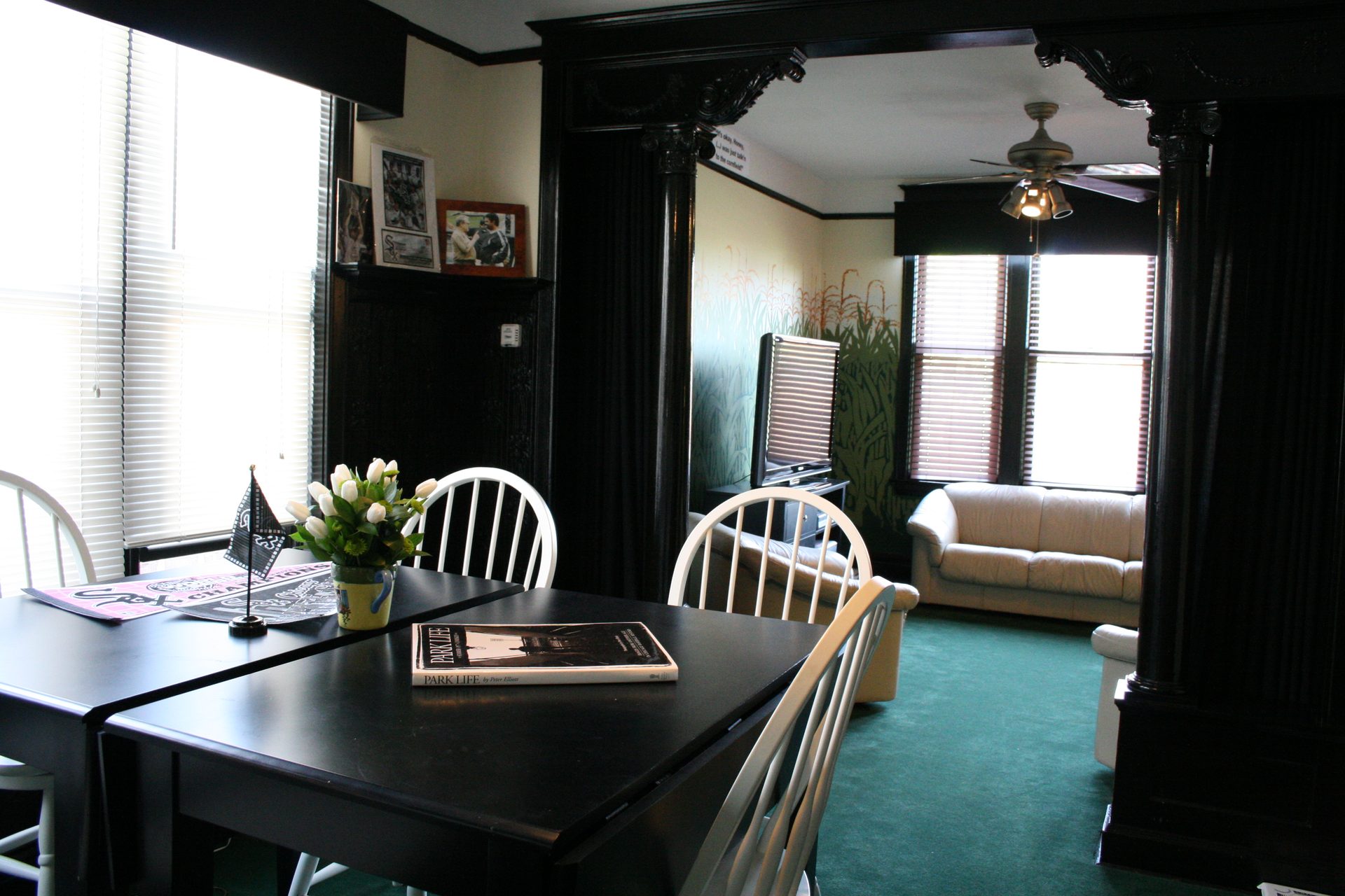 The Sox Suite living area with dark wood columns