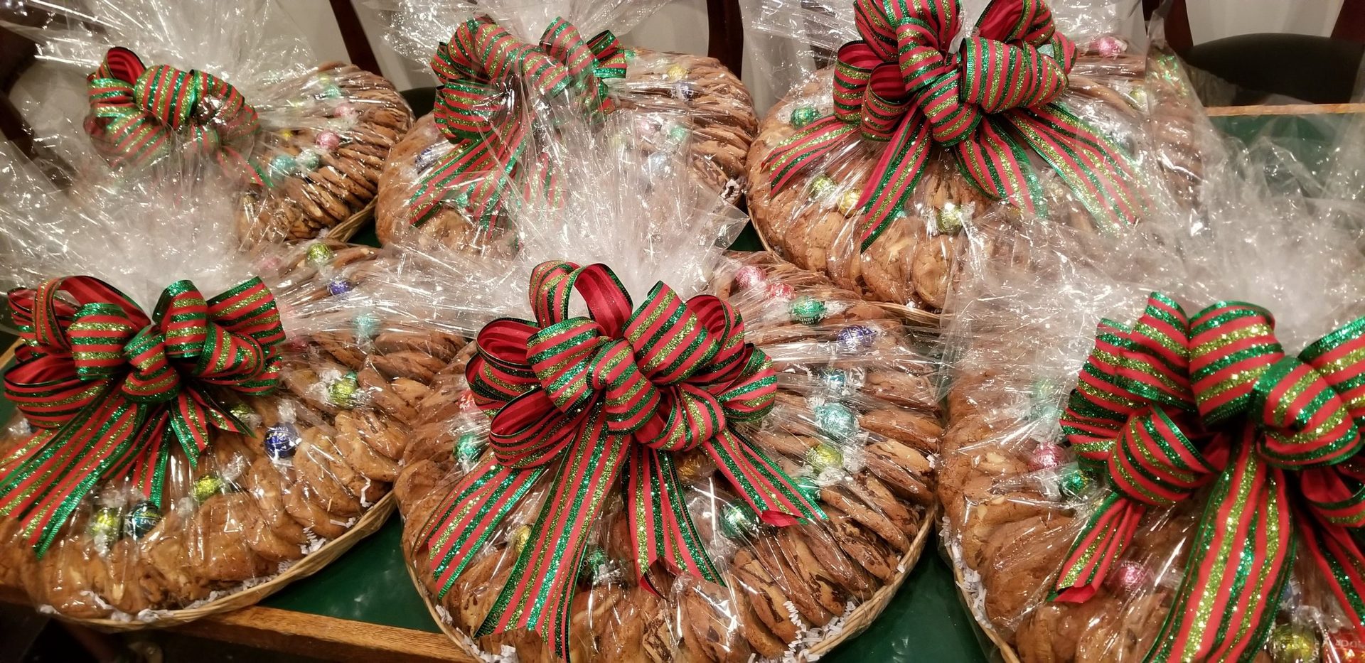 Polo cookie gift trays wrapped in cellophane with festive hand-tied bows