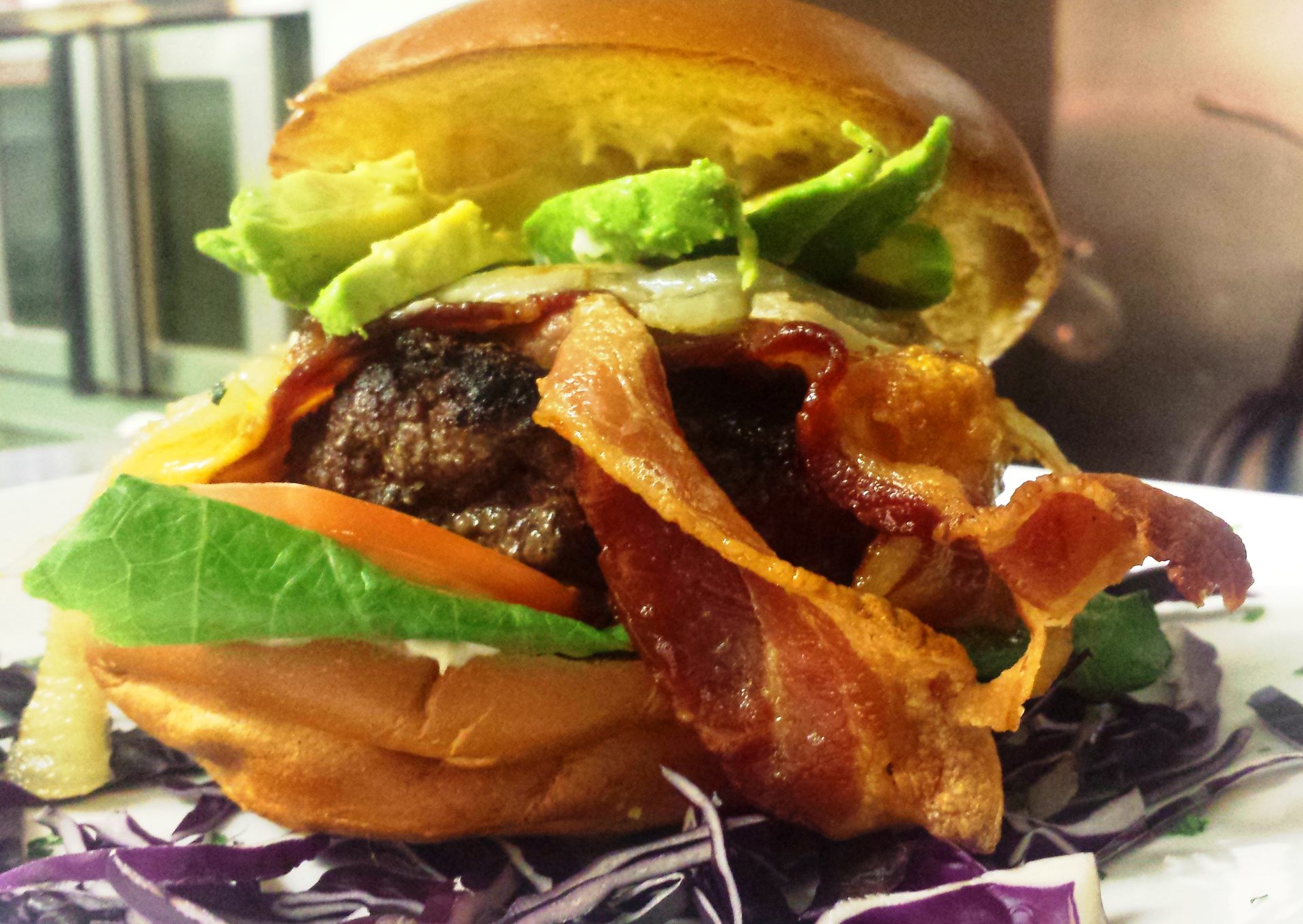 The Angus 'Stockyarder' burger — house-ground, bacon and avocado on a brioche bun